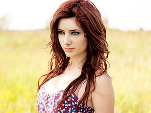 woman wearing blue and red floral top