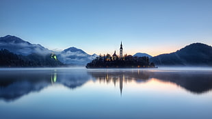 landscape photography of lighthouse, lake, reflection, island, water