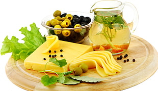 cheese near parsley with olive on clear glass bowl with tea in glass pitcher HD wallpaper