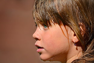 selective focus of girl's face during daytime