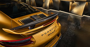 yellow Porsche 911 Caymen S