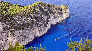 green rock island, nature, rock, boat, water