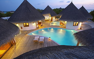 white and black cottages, swimming pool, hotel