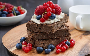 brown pastries with red and blue berries