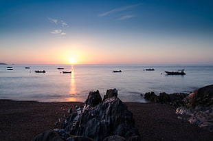 boat sailing during sunset