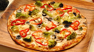 Pizza on brown wooden tray HD wallpaper