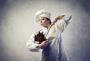 woman wearing chef suit mixing liquid chocolate HD wallpaper