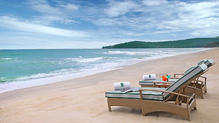 brown wooden sofa bed, beach, sand, sea, hills