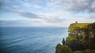 green and brown landmark island, coast, castle, water