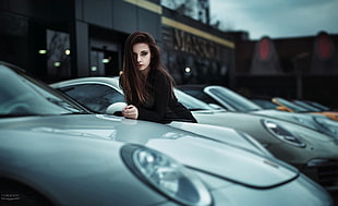 woman in black dress stands beside gray cars HD wallpaper