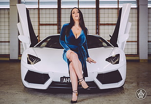 woman in blue plunging neckline dress sitting on white Lamborghini supercar HD wallpaper
