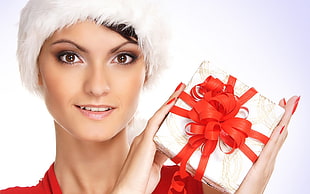 woman holding white box with red ribbon HD wallpaper