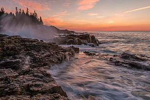 rocky seashore during sunset