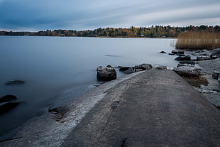 timelapse photography of lake near road HD wallpaper