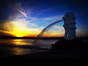 Merlion statue during golden hour HD wallpaper