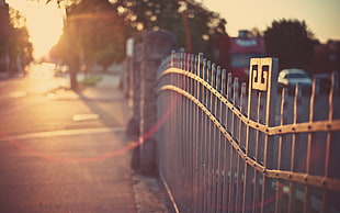 black and white basketball hoop, urban, gates, sunlight, fence