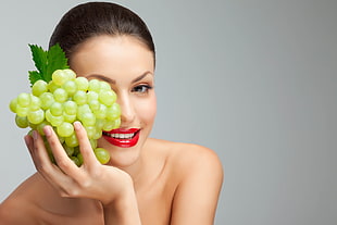 woman holding green grape HD wallpaper