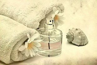 clear glass perfume spray bottle with two white towels HD wallpaper