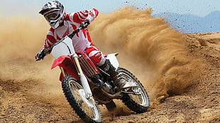 person riding red and white motocross bike HD wallpaper