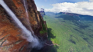 brown and white water fall during day time