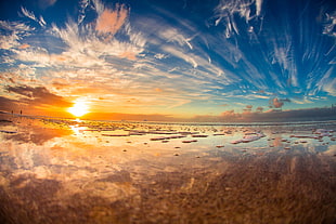 ocean near mountain during sunrise, north shore, hawaii