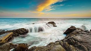 brown rock formation, beach, horizon, sky, sea