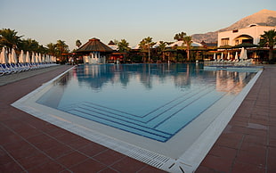 below ground pool, swimming pool, building, hotel