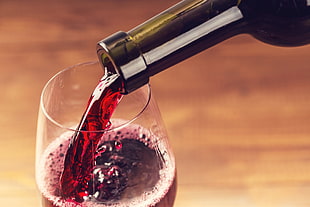 red wine poured on clear wineglass HD wallpaper