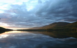 landscape photography of a body of water near mountains