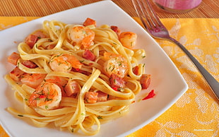 pasta with shrimp on square white ceramic plate beside stainless steel fork HD wallpaper
