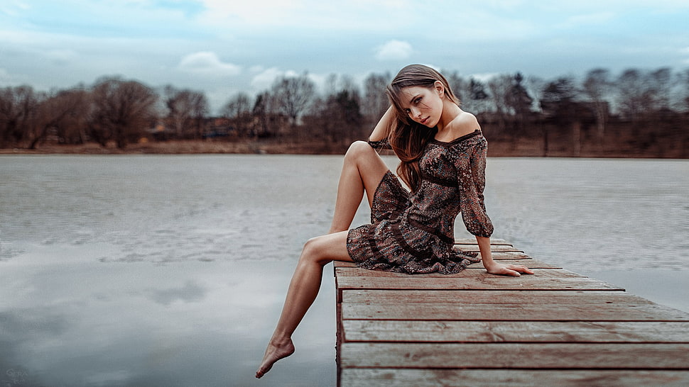 woman in brown dress sitting on boat dock HD wallpaper