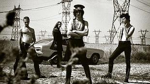 band member taking photo behind power lines during daytime