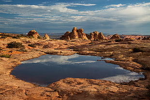 landscape photography of lake under white clouds HD wallpaper