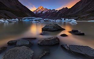 body of water high contrast photo, mountains, ice, stones, landscape