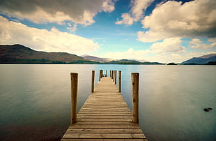 center photo boat dock under nimbus clouds and clear blue calm sky HD wallpaper