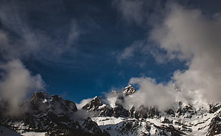 mountain covered with white snow during daytime