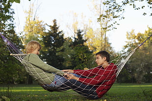 man and woman on hammock HD wallpaper