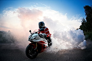 man riding white sports motorcycle during daytime HD wallpaper