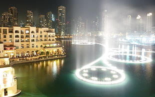 beige painted building beside body of water with dancing water, city, cityscape, United Arab Emirates, Dubai HD wallpaper