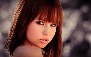 bokeh photo of brown-haired woman during daytime HD wallpaper