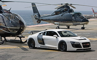 white Audi R8 1st gen coupe near two black helicopters HD wallpaper