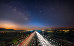 gray asphalt road, road, light trails, long exposure, stars HD wallpaper