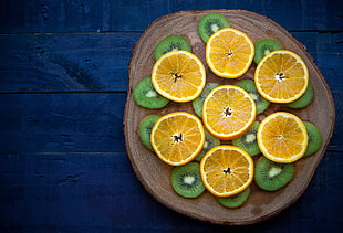 food photography of sliced kiwis and oranges HD wallpaper