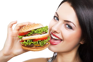 photo of woman holding burger HD wallpaper