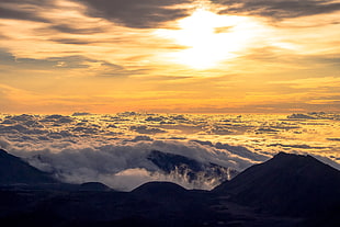 mountain peaks under white clouds