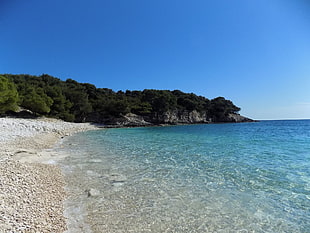 blue sea under blue sky HD wallpaper