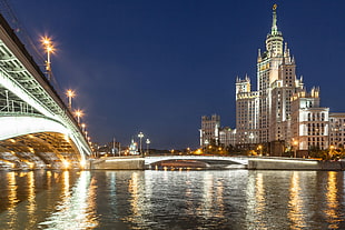 city buildings with lights during night time HD wallpaper