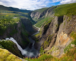 running water between two valleys