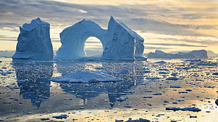 blue and white concrete house, water, iceberg, snow