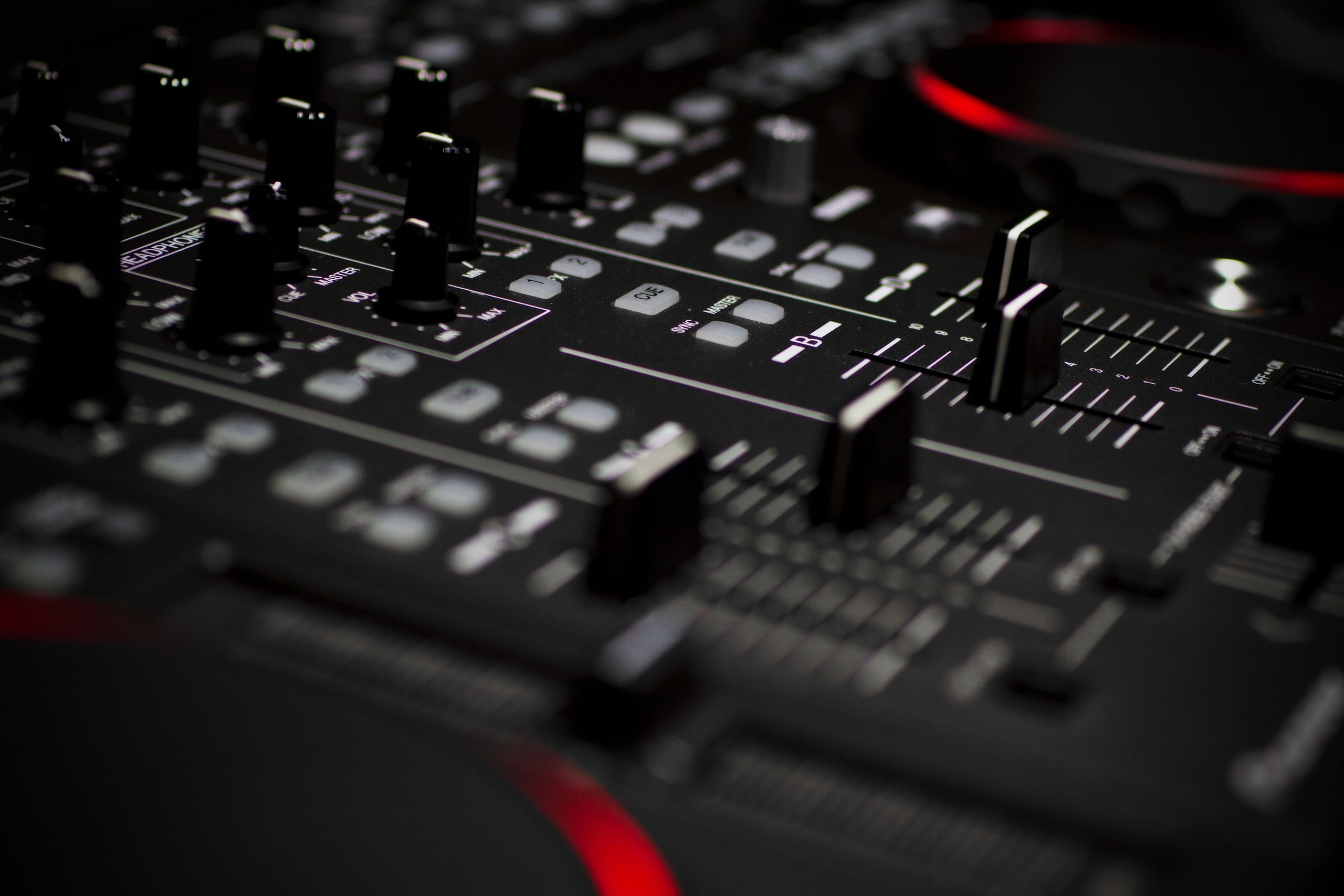 selective focus photography of black audio mixer, mixing consoles, technology, depth of field, red